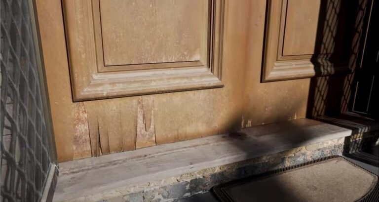 Worn exterior door with visible weathering on North Georgia home