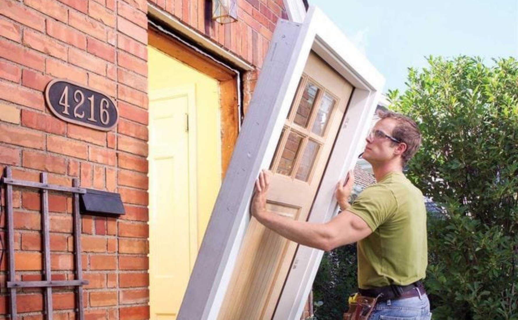 Professional installer fitting exterior door on North Georgia home