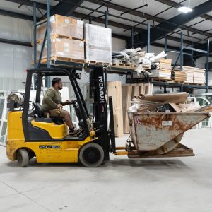 Forklift moving stock through the warehouse